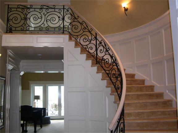 View more about Grand Staircase with Wrought Iron Railing